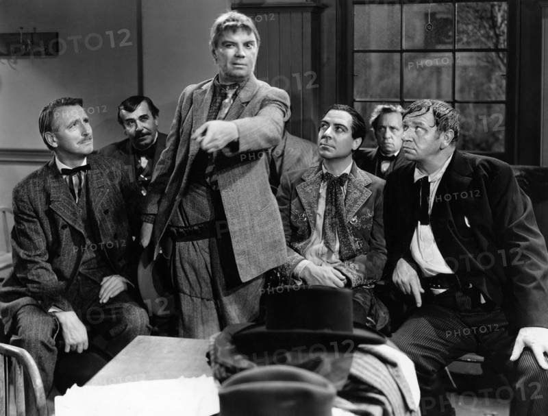 Wallace Beery (seated right), on-set of the western film, "The Bad Man Of Brimstone", Loew's Inc., 1937