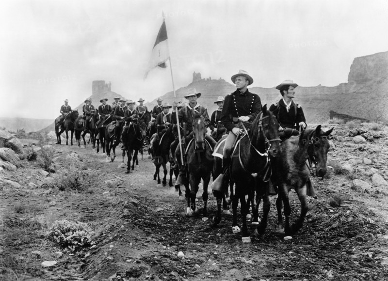 John Lund (foreground, center on horseback), on-set of the western film, "Battle At Apache Pass", Universal International, 1952
