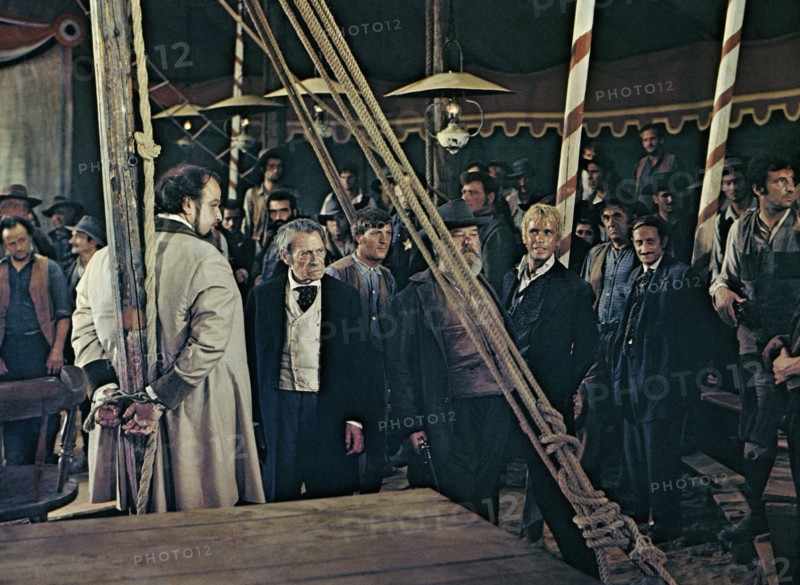 Victor Buono (tied to pole), on-set of the spaghetti western film, "Boot Hill", Italian: "La collina degli stivali", re-released as "Trinity Rides Again", Euro International Films, Film Ventures, 1969