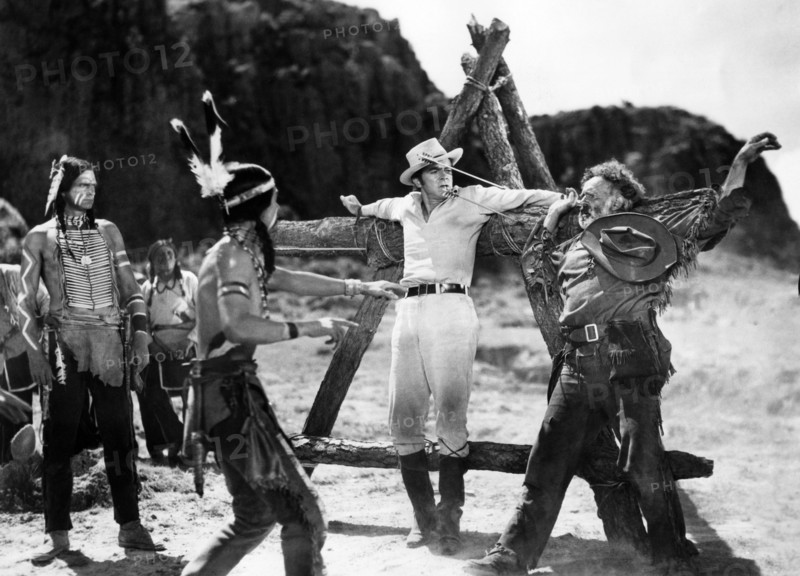 Henry Brandon (left), Dana Andrews (center), Nestor Paiva (right), on-set of the western film, "Comanche", United Artists", 1956