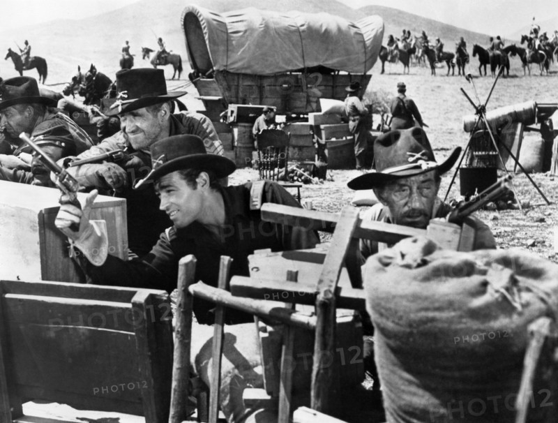 James Whitmore (foreground, left), Guy Madison (foreground, right), on-set of the western film, "The Command", Warner Bros., 1954