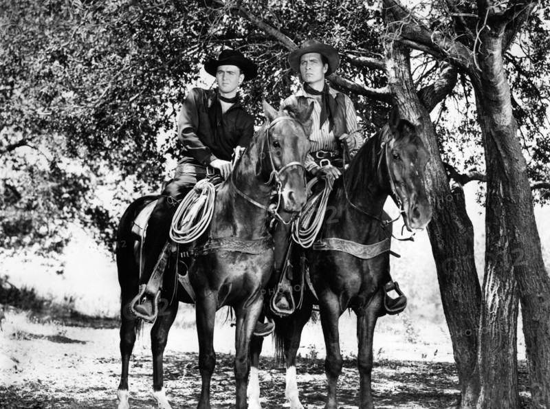 Jerome Courtland, George Montgomery, on-set of the western film, "Cripple Creek", Columbia Pictures, 1952
