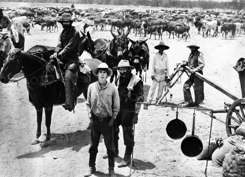 Gary Grimes (foreground, left), Raymond Guth (foreground, right), on-set of the western film, "The Culpepper Cattle Co.", 20th Century-Fox, 1972
