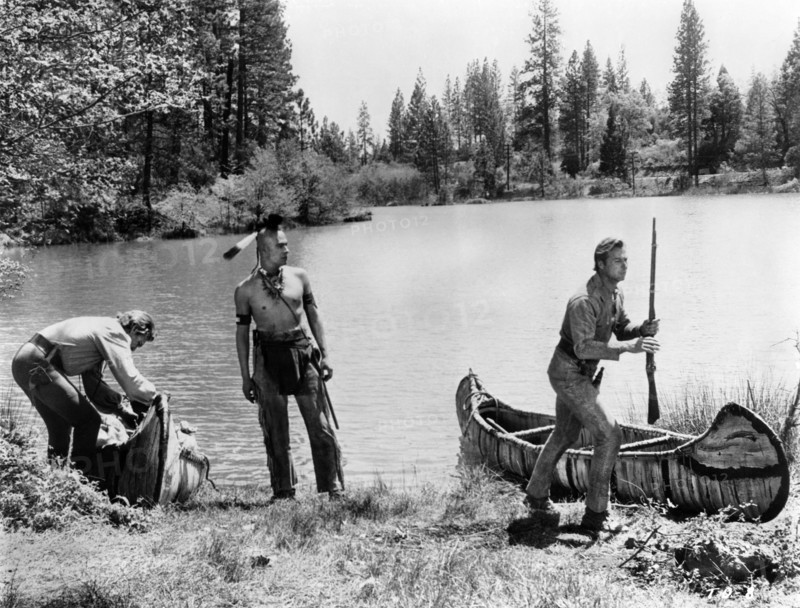 Forrest Tucker, Carlos Rivas, Lex Barker, on-set of the western film, "The Deerslayer", 20th Century-Fox, 1957