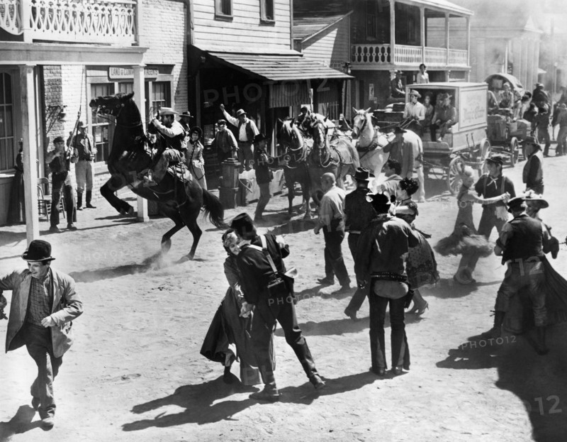 Street scene celebrating end of American Civil War, on-set of the western film, "The Fastest Guitar Alive", MGM, 1967