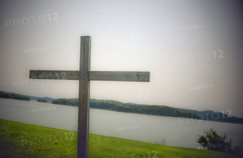 Wood cross on grass overlooking bay, Castine, Maine, USA
