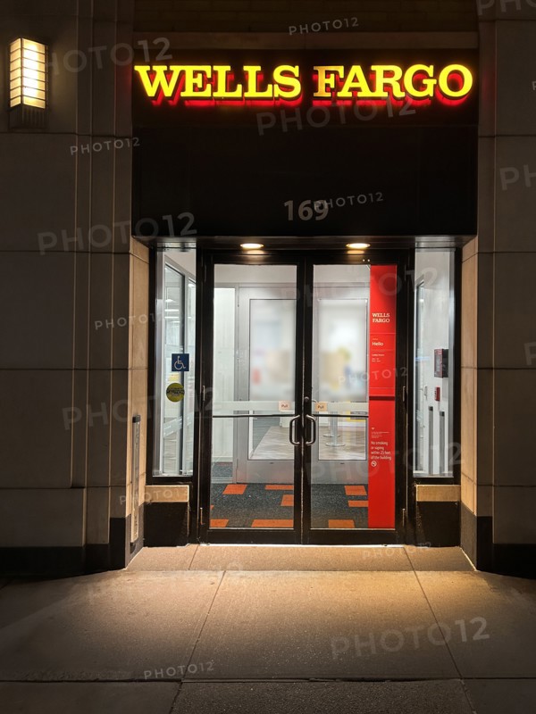 Wells Fargo Bank, building exterior and entrance at night, New York City, New York, USA