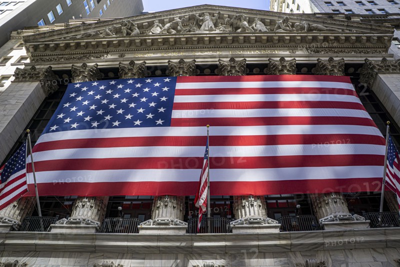 New York Stock Exchange, building exterior draped with large American flag, New York City, New York, USA