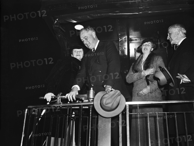 U.S. Secretary of Labor Frances Perkins (left), U.S. President Franklin Roosevelt (2nd left), U.S. First Lady Eleanor Roosevelt (2nd right), aboard train departing for Warm Springs, Georgia, Washington, D.C., USA, Harris & Ewing, 1935