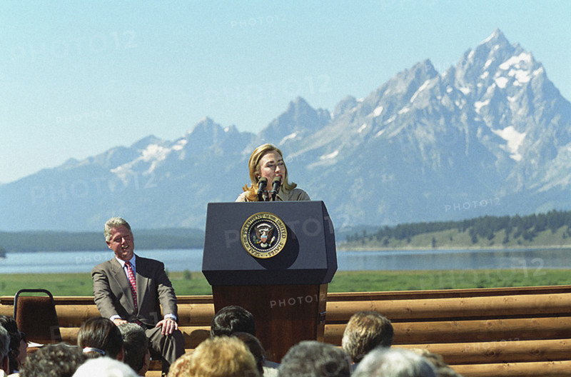 U.S. First Lady Hillary Rodham Clinton delivering remarks, as U.S. President Bill Clinton looks on,  at event marking 75th anniversary of Women's Suffrage, Jackson, Wyoming, USA, Bob McNeely, White House Photograph Office, August 26, 1995