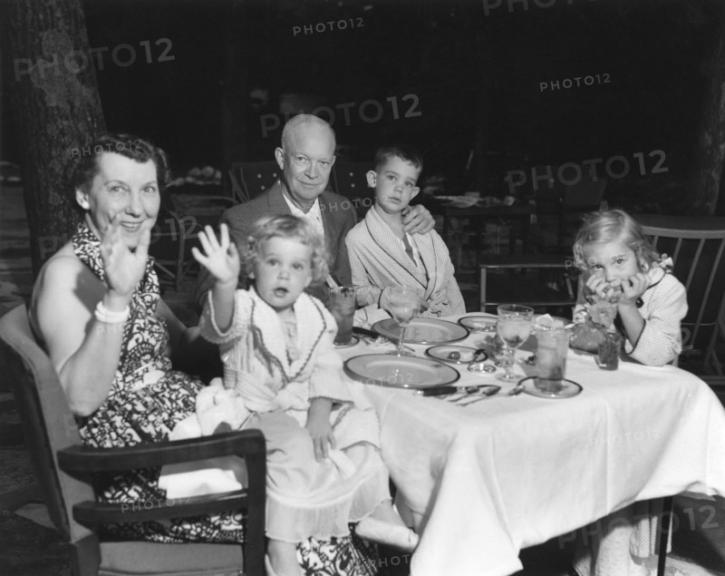 U.S. President Dwight D. Eisenhower and U.S. First Lady Mamie Eisenhower spending weekend vacation at Camp David with their grandchildren, Left to right: Mamie Eisenhower holding Susan, Dwight D. Eisenhower, David, and Anne, Frederick County, Maryland, USA, U.S. Navy Photo, July 30, 1954