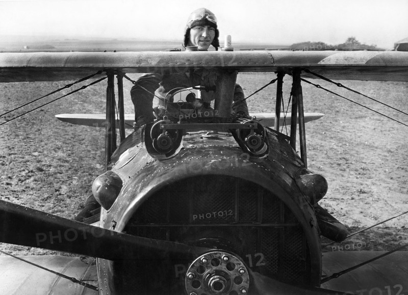 First Lieutenant E. V. "Eddie" Rickenbacker, 94th Aero Squadron, American ace, standing up in his Spad plane, near Rembercourt, France, U.S. Army Signal Corps, October 1918