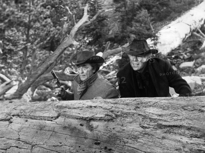 Robert Mitchum, George Kennedy, on-set of the western film, "The Good Guys And The Bad Guys", Warner Bros.-Seven Arts, 1969
