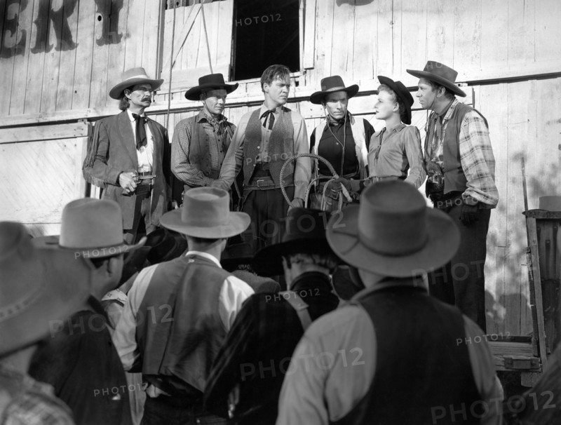 Jack Tornek, Kirby Grant, Dan White, Louise Curry, Fuzzy Knight, on-set of the western film, "Gun Town", Universal Pictures, 1946