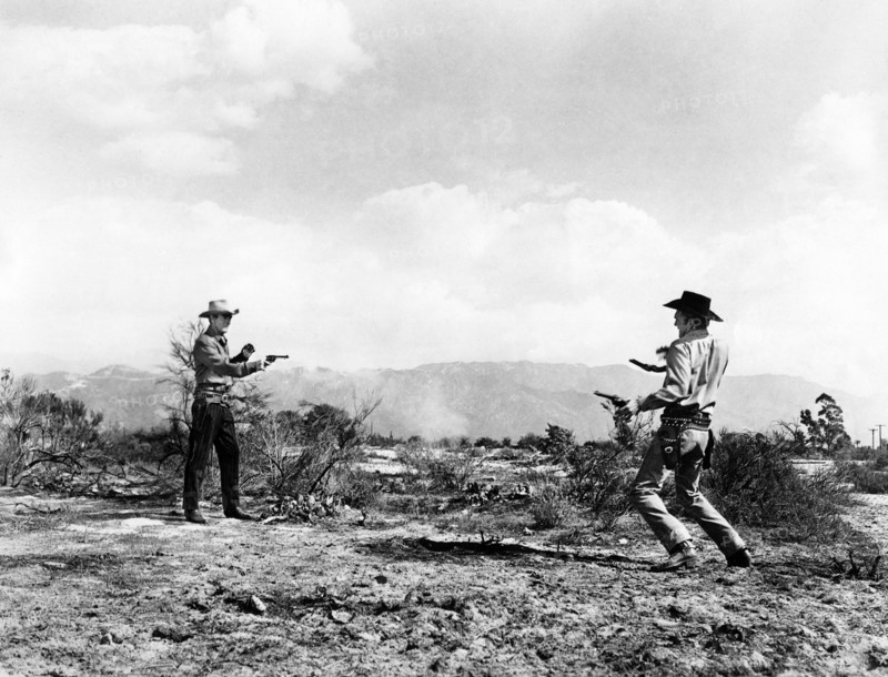 Randolph Scott, Forrest Tucker, on-set of the western film, "Gunfighters", Columbia Pictures, 1947