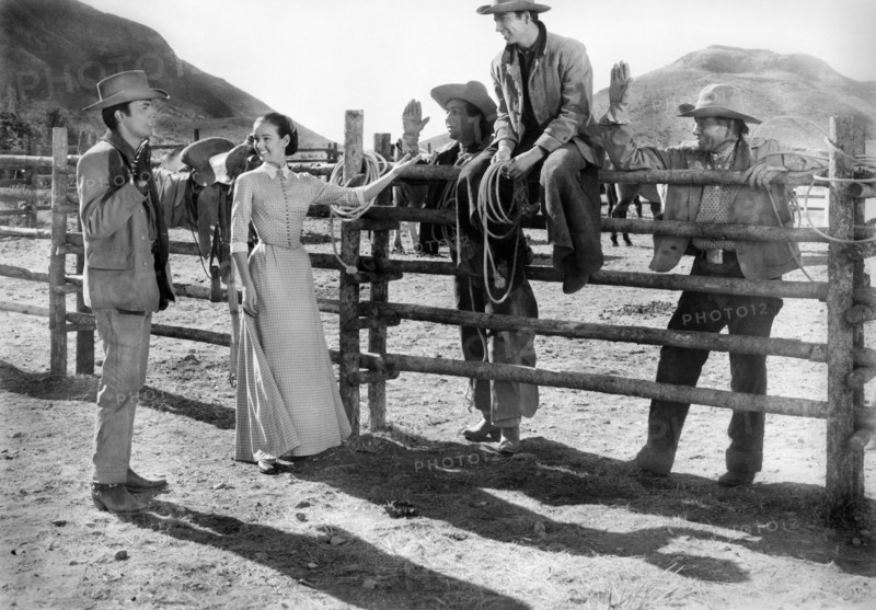 James Darren (left), Kathryn Grant, Bert Convy (sitting on fence), on-set of the western film, "Gunman's Walk", Columbia Pictures, 1958