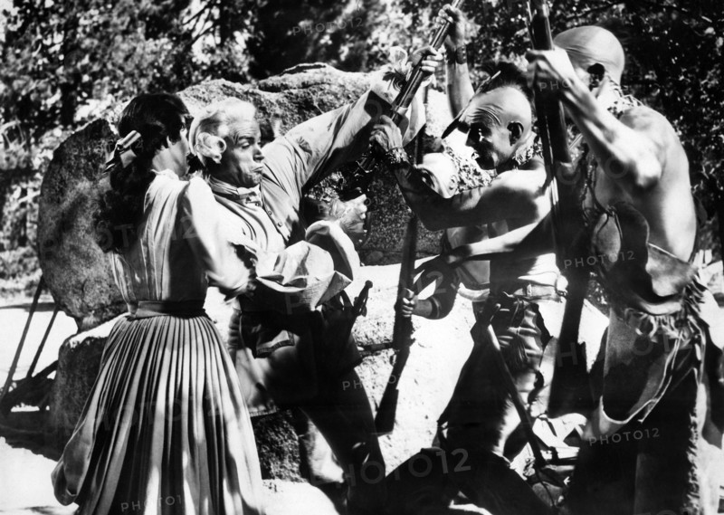Brenda Marshall (left), Glen Langan (2nd left), on-set of the western film, "The Iroquois Trail", United Artists, 1950