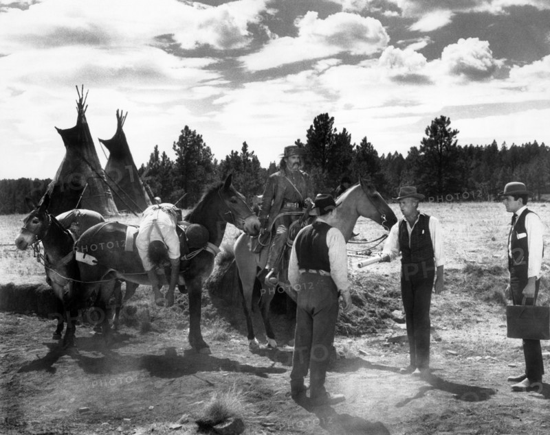 Henry Fonda (on horse), Richard Widmark (2nd right), on-set of the western film, "How The West Was Won", MGM, 1962