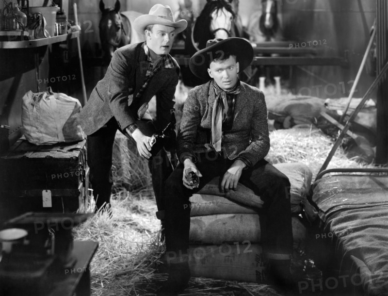 Dennis O'Keefe, Buddy Ebsen, on-set of the western film, "The Kid From Texas", MGM, 1939