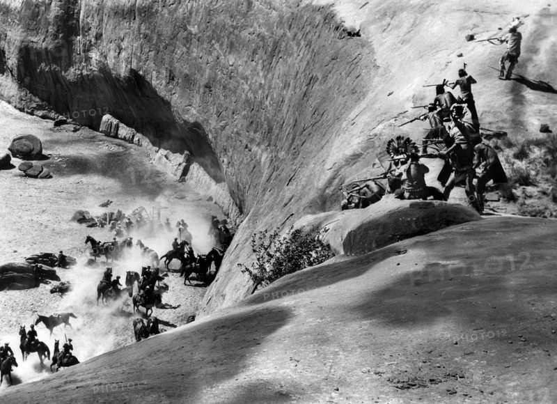 Shoshone fighters attacking U.S. Cavalry, on-set of the western film, "Kit Carson", United Artists, 1940