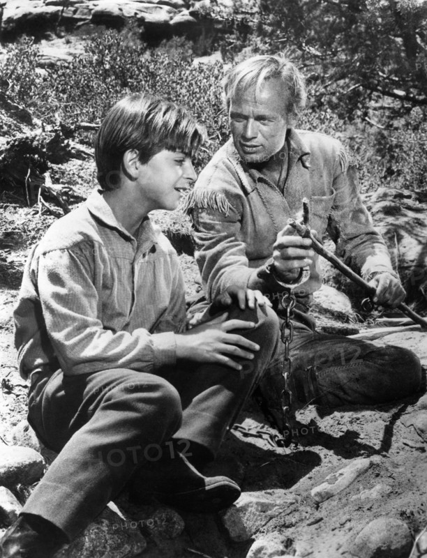 Tommy Rettig, Richard Widmark, on-set of the western film, "The Last Wagon", 20th Century-Fox, 1956