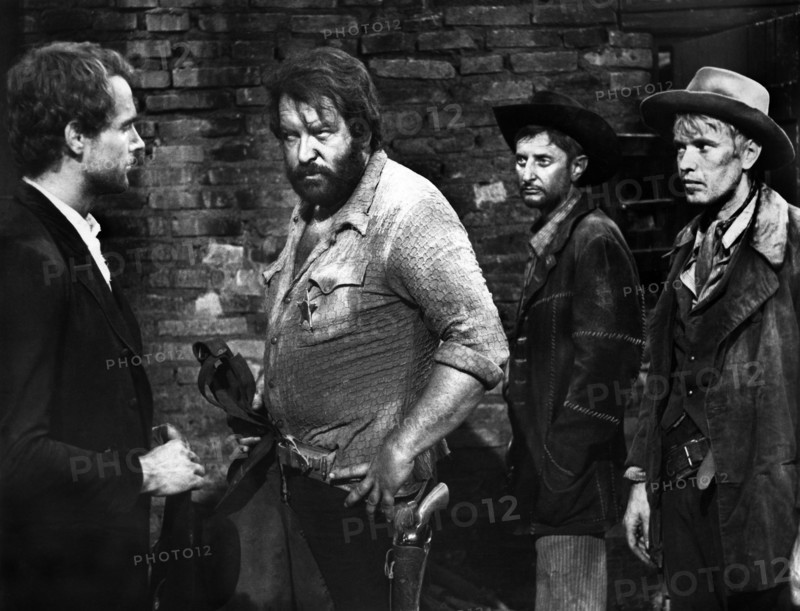 Terence Hill (left,) Bud Spencer (2nd left), Ezio Marano (2nd right), on-set of the Italian spaghetti western film, "They Call Me Trinity", Italian: "Lo chiamavano Trinità", Delta, 1970, AVCO Embassy Pictures, 1971