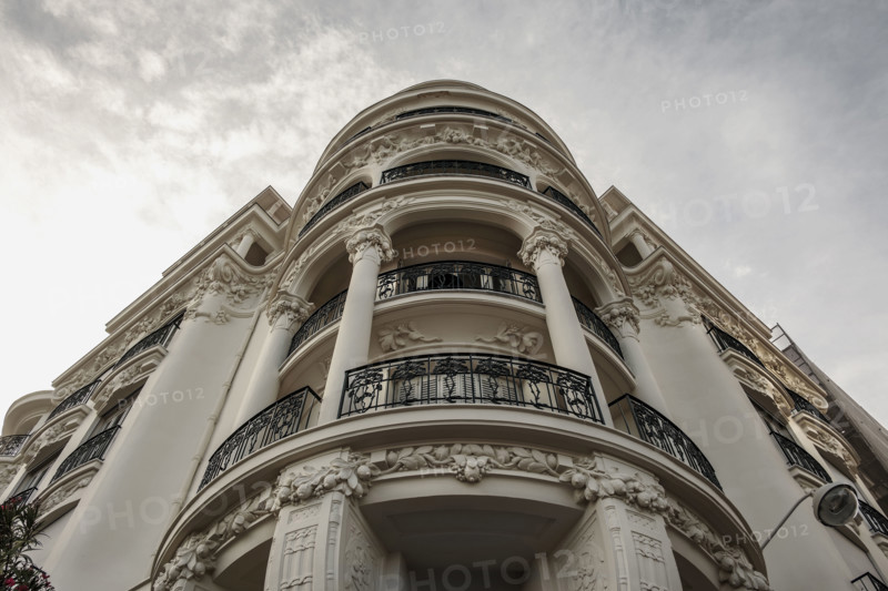 Low angle view of curved hotel balconies, Nice, France