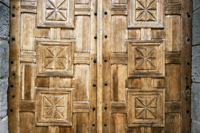 Close-up view of Intricately carved wood doors
