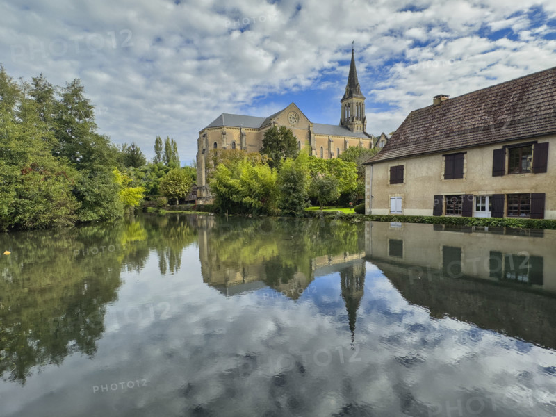 Reflections on scenic river, Le Bugue, France