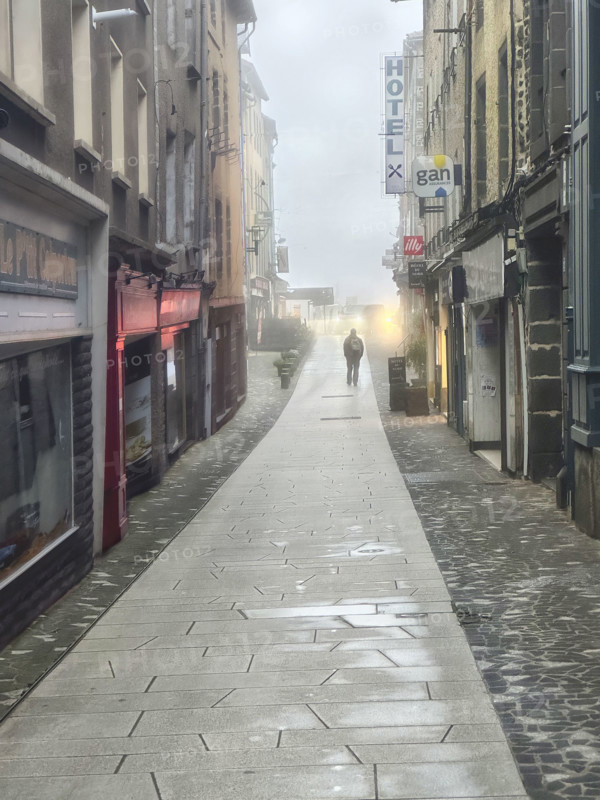 Street scene on foggy morning, Saint-Flour, France