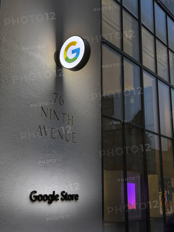 Google store at night, illuminated company logo on building exterior, New York City, New York, USA