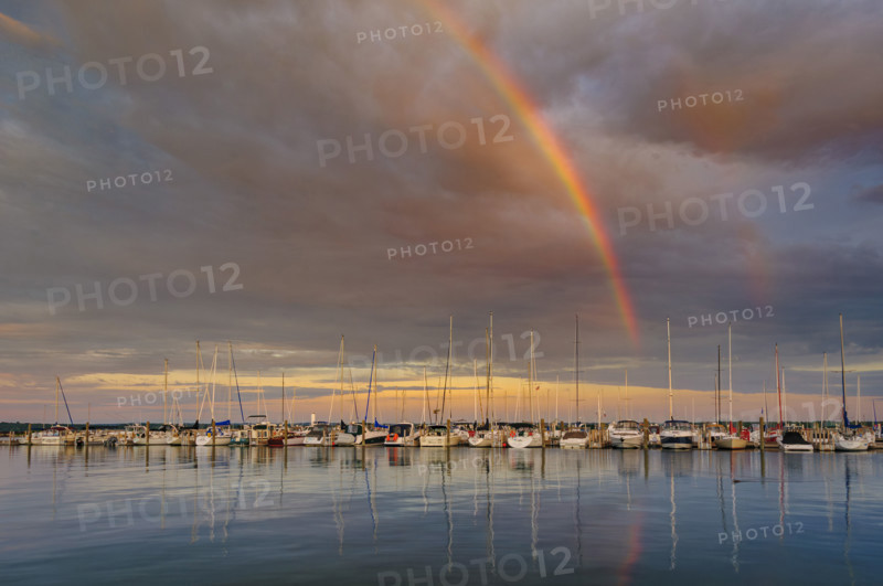 Rainbow and dramatic sky over harbor, Traverse City, Michigan, USA
