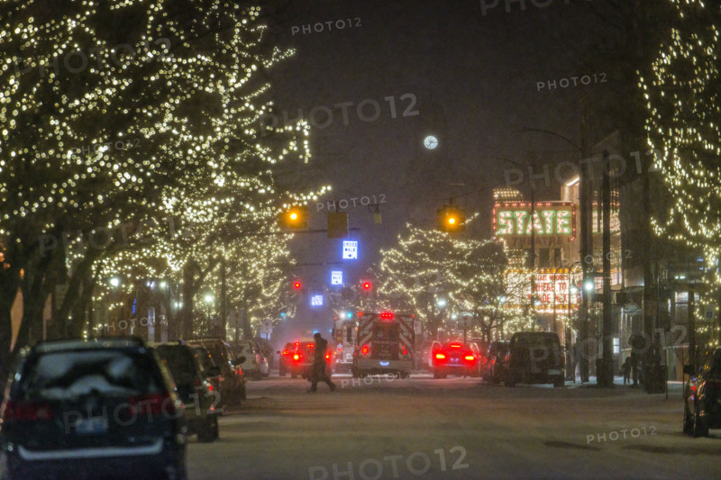 Snowy street scene at night, Traverse City, Michigan, USA