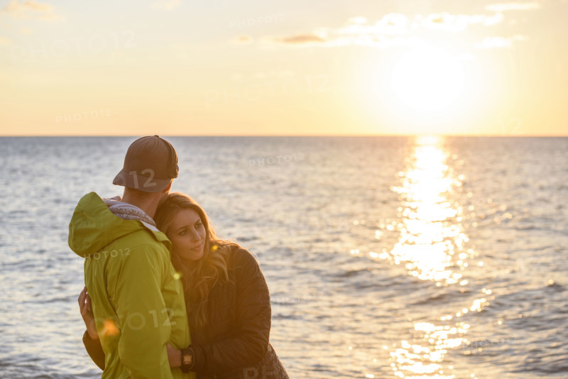 Affectionate couple enjoying sunset at beach