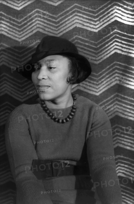 Zora Neale Hurston, American author, anthropologist, playwright, and filmmaker, who was active in the Harlem Renaissance, head and shoulders portrait, Carl Van Vechten, April 1938