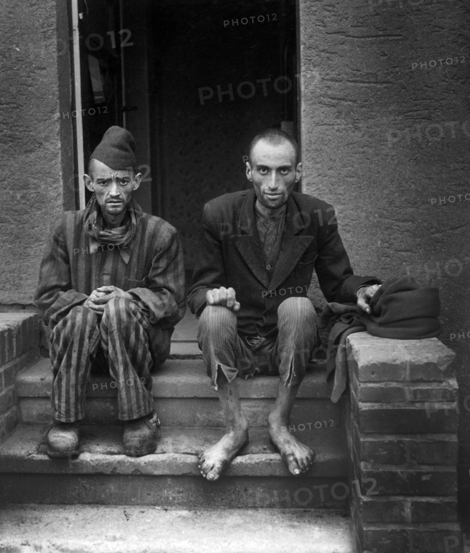 Two staring, emaciated men after being liberated from Mittelbau-Dora, a Gestapo concentration camp, Lager Nordhausen, Germany, U.S. Army Signal Corps, April 12, 1945