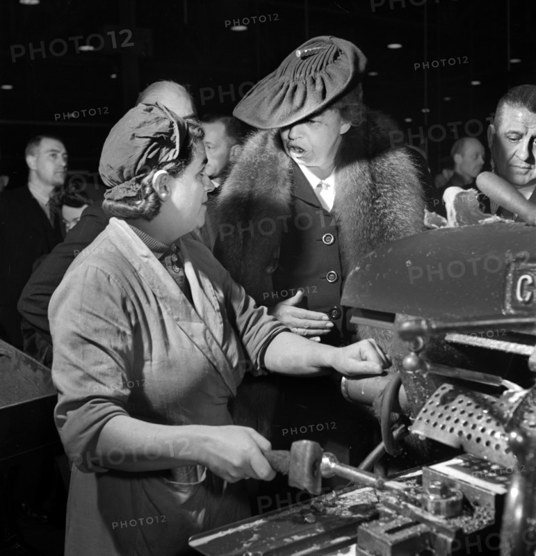 U.S. First Lady Eleanor Roosevelt talking with woman machinist during her goodwill tour of Great Britain, Toni Frissell, November 1942