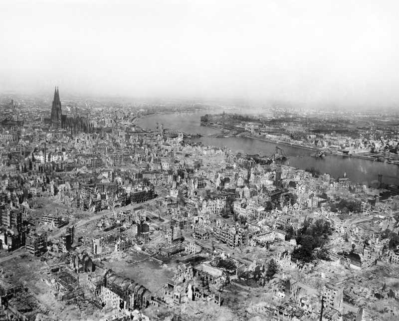 Cologne Cathedral standing undamaged while entire area surrounding it is completely devastated with railroad station and Hohenzollern Bridge lying damaged to the north and east of the cathedral, Cologne, Germany, U.S. Army Signal Corps, April 24, 1945