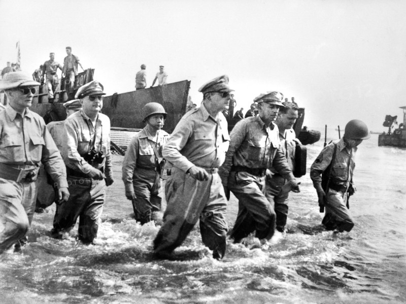 U.S. General Douglas MacArthur wading ashore during initial landings at Leyte Island, Philippine, U.S. Army Signal Corps, October 1944