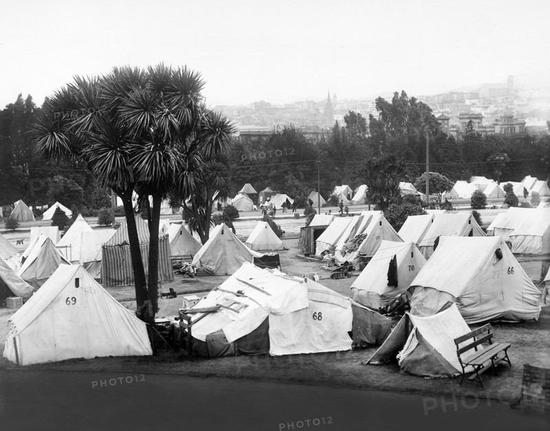 Refugee camp established after earthquake in Jefferson Park in vicinity of Eddy and Gough Streets; the large church tower shown on right is Sacred Heart Church, Fillmore and Fulton Streets, San Francisco, California, USA, U.S. Army Signal Corps, 1906