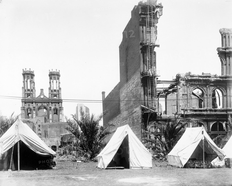 Refugee tents and damaged buildings from earthquake, Union Square Park, with synagogue on Sutter Street in background, San Francisco, California, USA, U.S. Army Signal Corps, April 1906