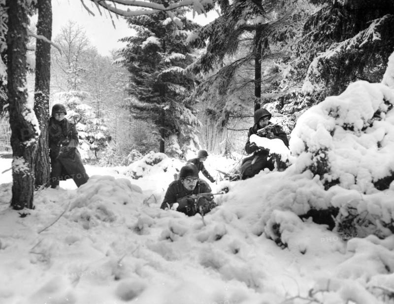 American infantrymen of the 29th Regiment., 75th Infantry Division fighting in fresh snowfall near Amonines, Belgium, U.S. Army Signal Corps, January 4, 1945