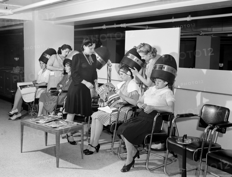 Women drying their hair in beauty shop at Crowley-Milner department store, Detroit, Michigan, USA, Arthur S. Siegel, U.S. Office of War Information, July 1941