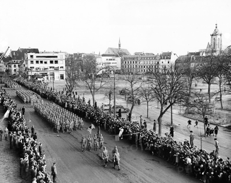 U.S. 28th Infantry Division leading the color guard at Victory Parade after the town's liberation, Colmar, France, U.S. Army Signal Corps, February 8, 1945