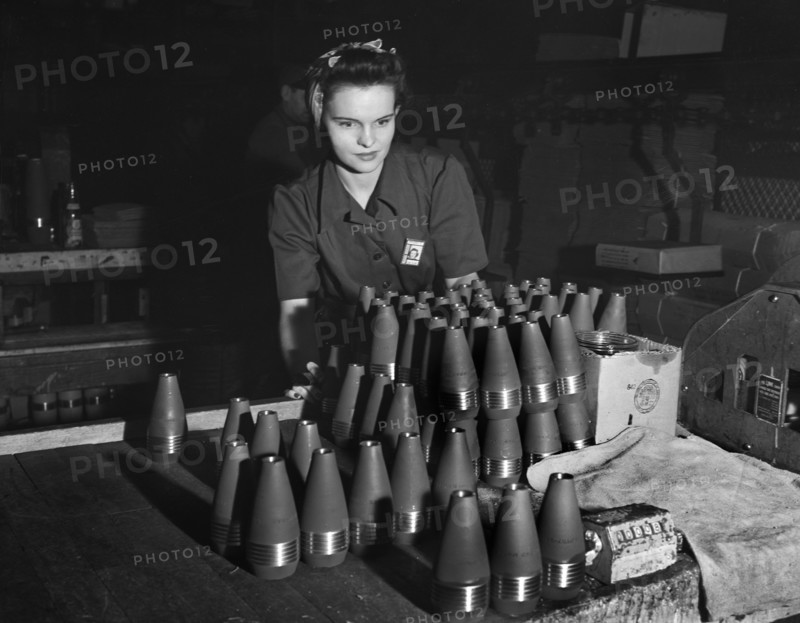 Female factory worker inspecting 60mm shells, Budd Wheel Plant, Detroit, Michigan, USA, Arthur S. Siegel, U.S. Office of War Information, January 1943