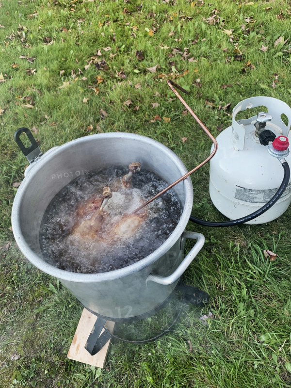 High angle view of deep frying turkey outdoor on autumn day