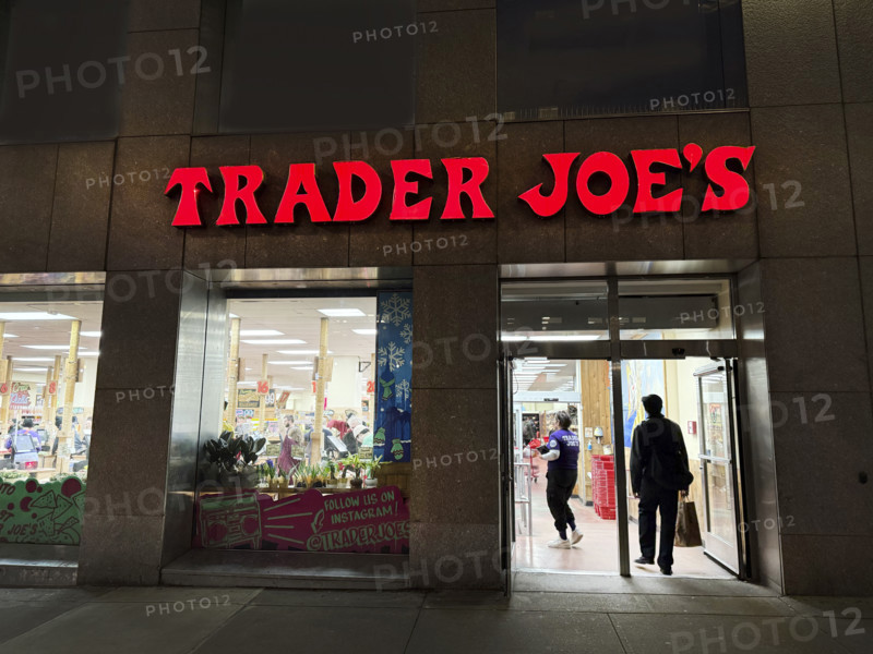 Trader Joe's grocery store, building exterior and entrance at night, New York City, New York, USA