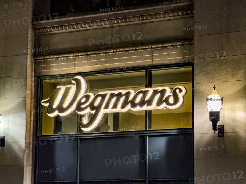 Wegman's, store logo on building exterior at night, low angle view of company sign, New York City, New York, USA