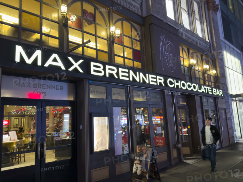 Max Brenner Chocolate Bar, building exterior at night, New York City, New York, USA