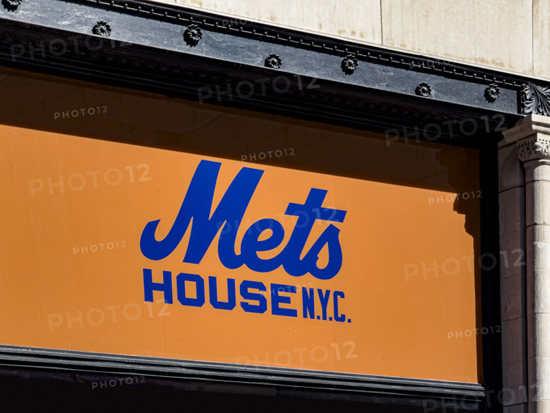 Mets House NYC, pop-up store and activities space, building exterior detail of orange and blue store sign, New York City, New York, USA